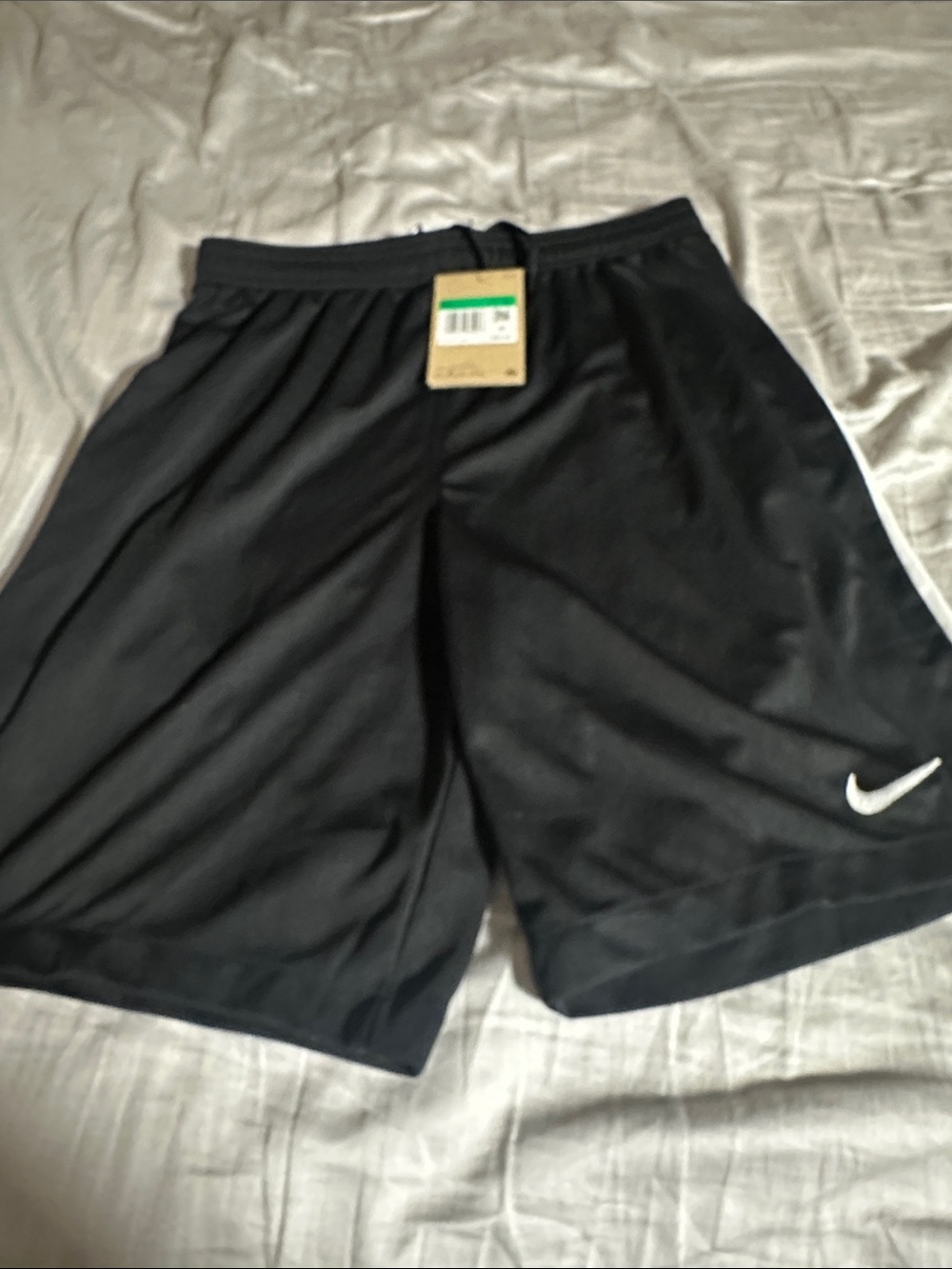 Nike kids Black Athletic Shorts with White Swoosh Accent